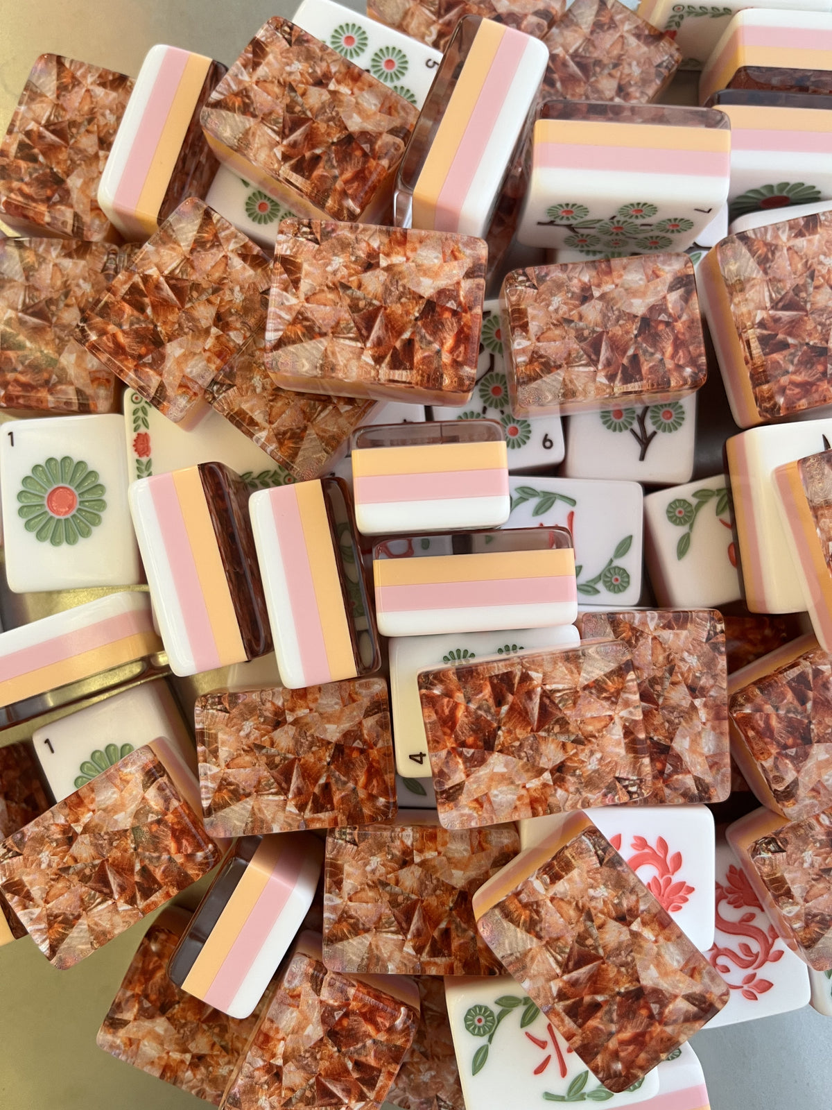 Amber Vine acrylic American mahjong face detail pile floral dots and copper backs — green red vine suits and amber flake shimmer, Mahjong Loft