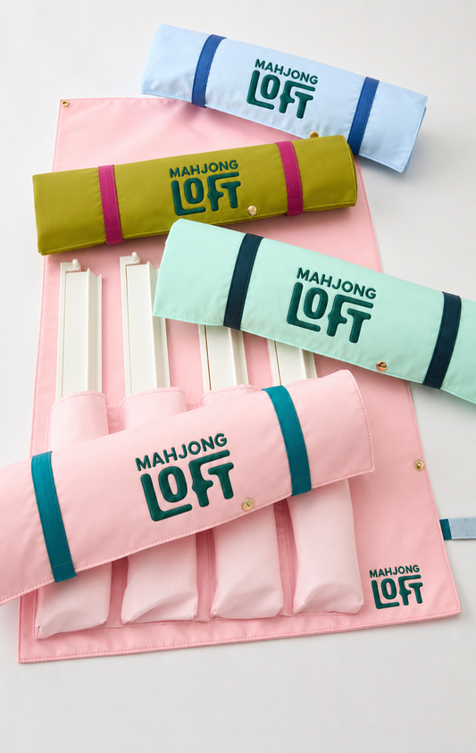 Roll-up mahjong rack and pusher bags in light blue, green, mint and pink, with racks tucked into an open pink bag
