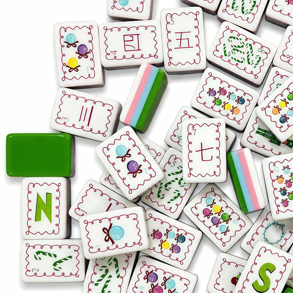 Evergreen Merriment acrylic American mahjong scattered tiles showing green backs — pink blue layer stripe proof, Mahjong Loft
