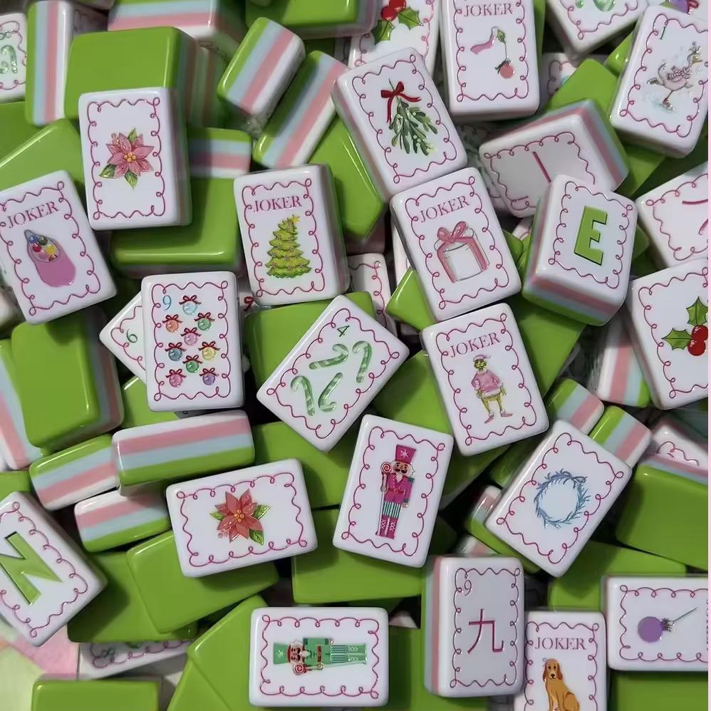 Evergreen Merriment acrylic American mahjong close-up festive joker pile — holiday character face detail, Mahjong Loft