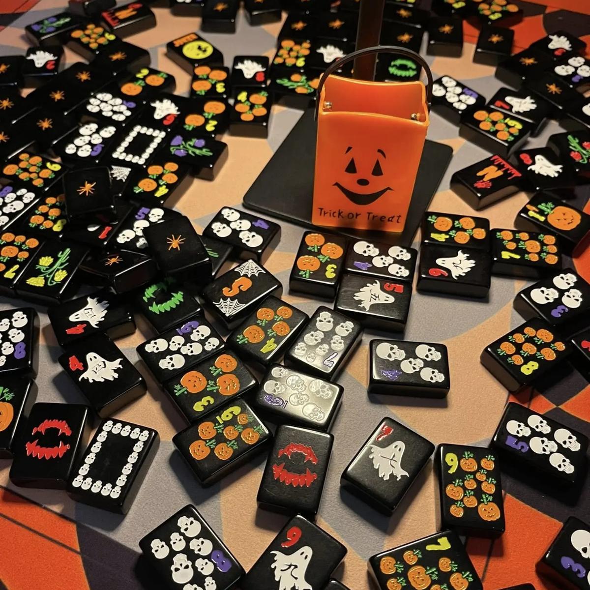 Jack-O Midnight acrylic American mahjong scattered faces on patterned cloth — jack-o lantern and ghost detail, Mahjong Loft