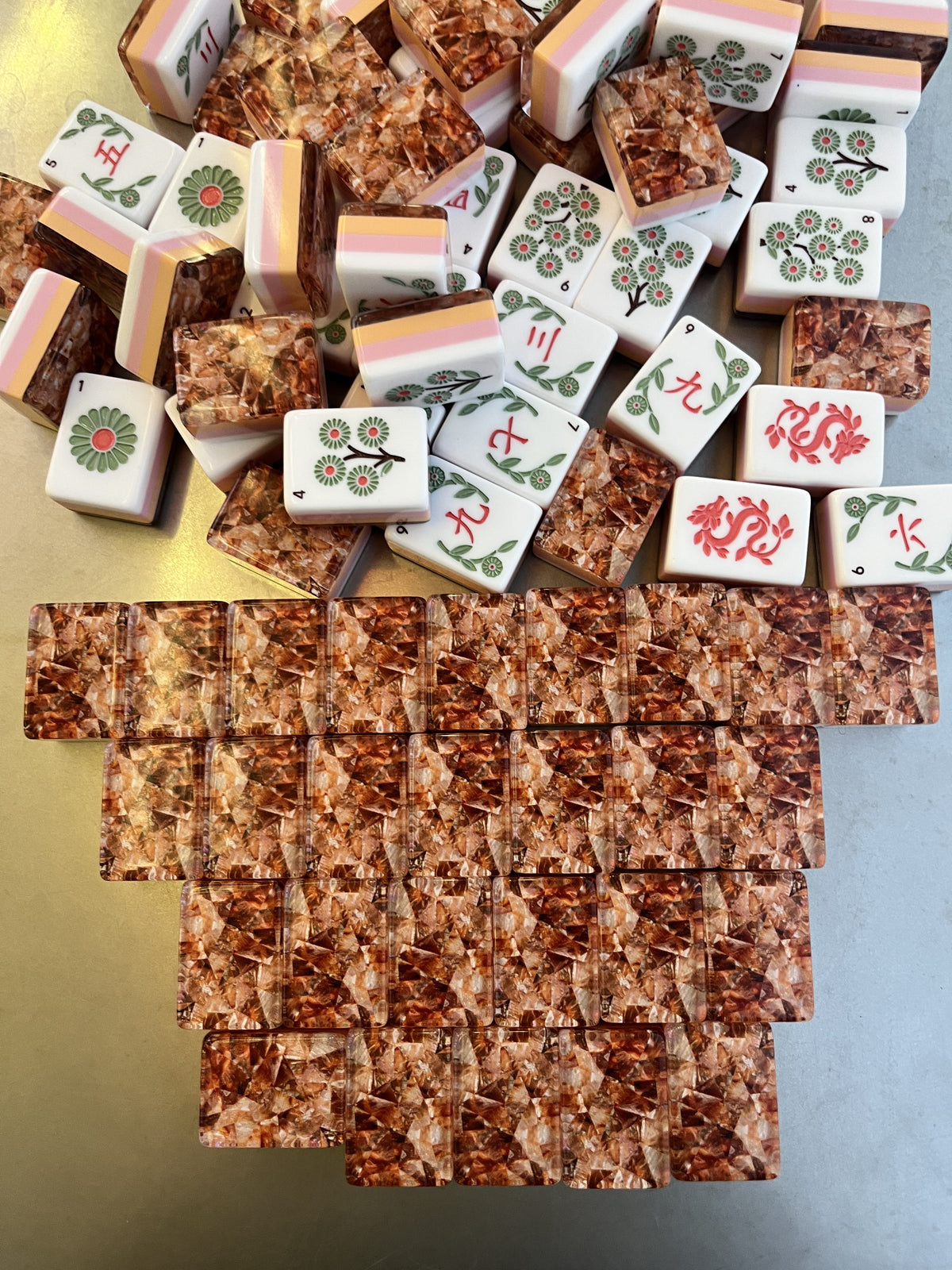Amber Vine acrylic American mahjong copper flake backs pyramid with construction stack — pink pale yellow mid-layers and amber flake backs, Mahjong Loft