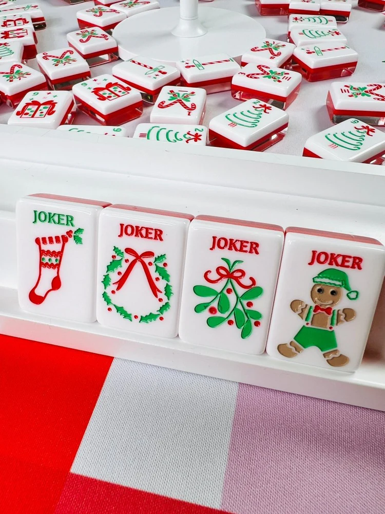Scarlet Stocking acrylic American mahjong joker tiles in rack close-up — stocking wreath mistletoe gingerbread, Mahjong Loft