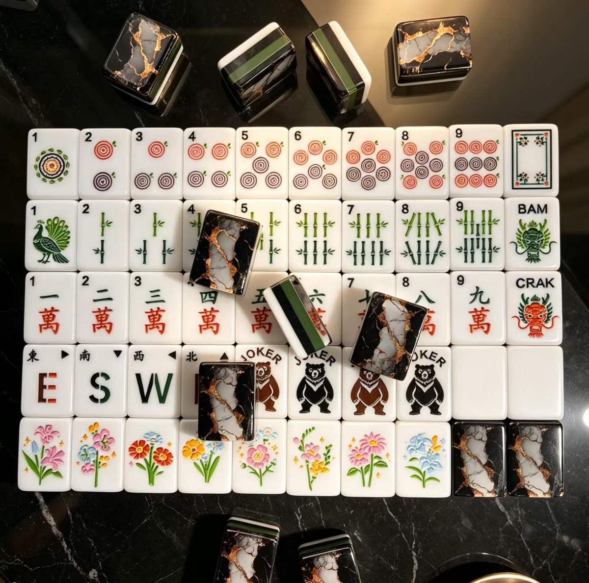 Gilded Obsidian acrylic American mahjong sample face grid on black — gold vein marble backs and green layers, Mahjong Loft
