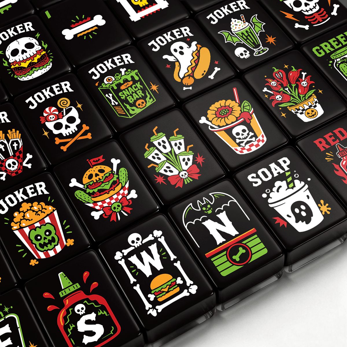 Skull Diner Halloween mahjong tiles close-up with skull milkshakes, ghost hot dogs, jack-o'-lantern flowers, and candy-corn dot designs on black acrylic