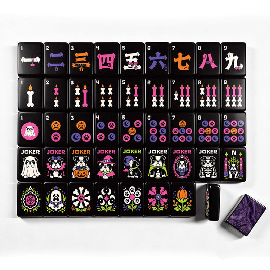 Complete Halloween mahjong tile layout showing numbered suits (dots, bams, cracks), dragons, winds, bulldog jokers, and floral flower tiles with gothic pumpkin, ghost, and skeleton artwork