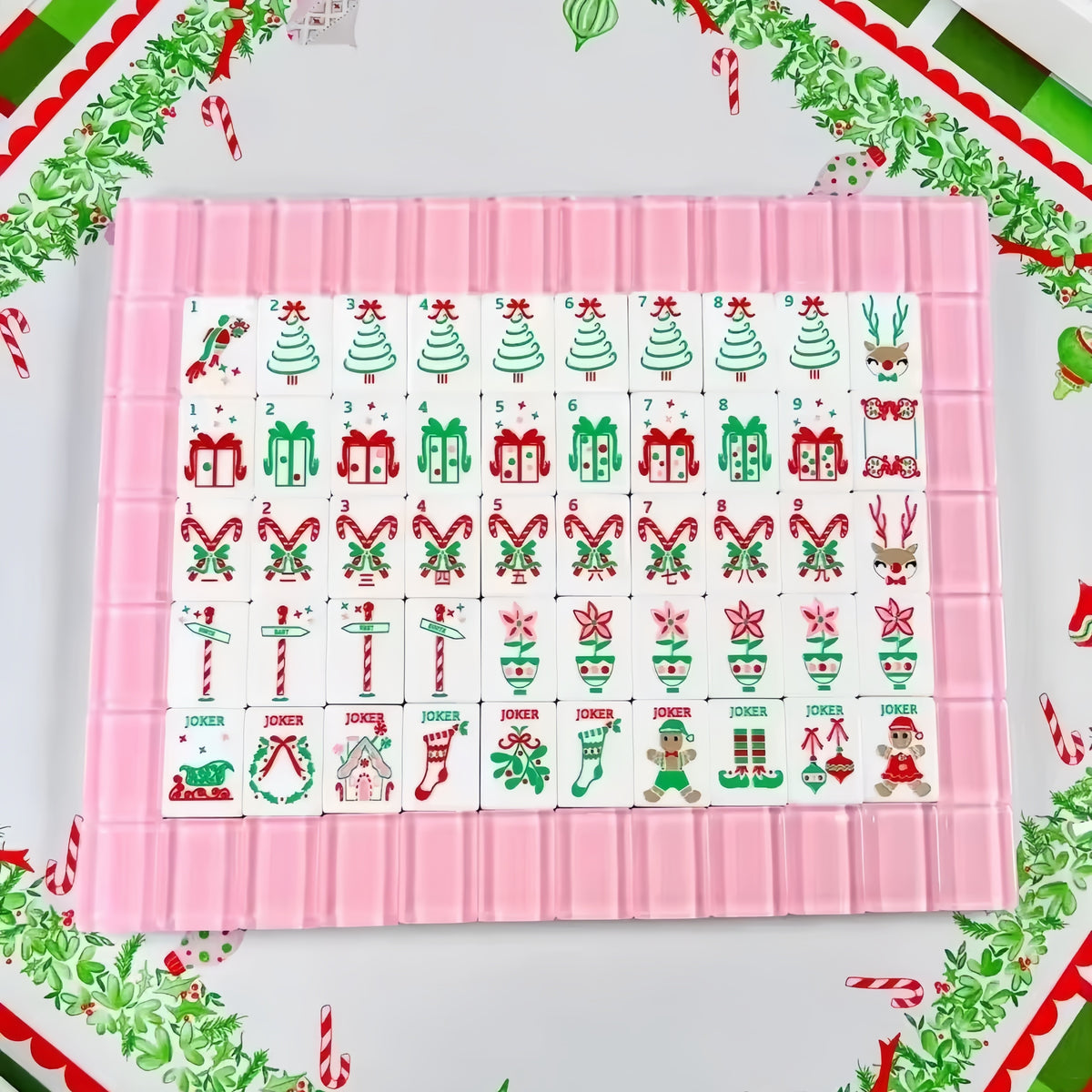 Pink Reindeer acrylic American mahjong full tile grid on festive tray — pink backs and Rudolph holiday faces, Mahjong Loft