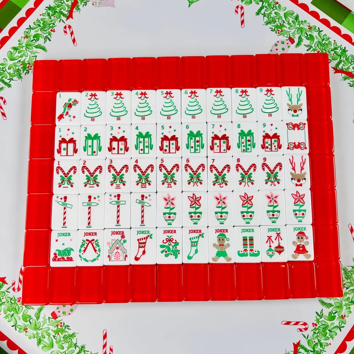 Scarlet Stocking acrylic American mahjong full tile grid on festive tray — red backs and holiday faces, Mahjong Loft