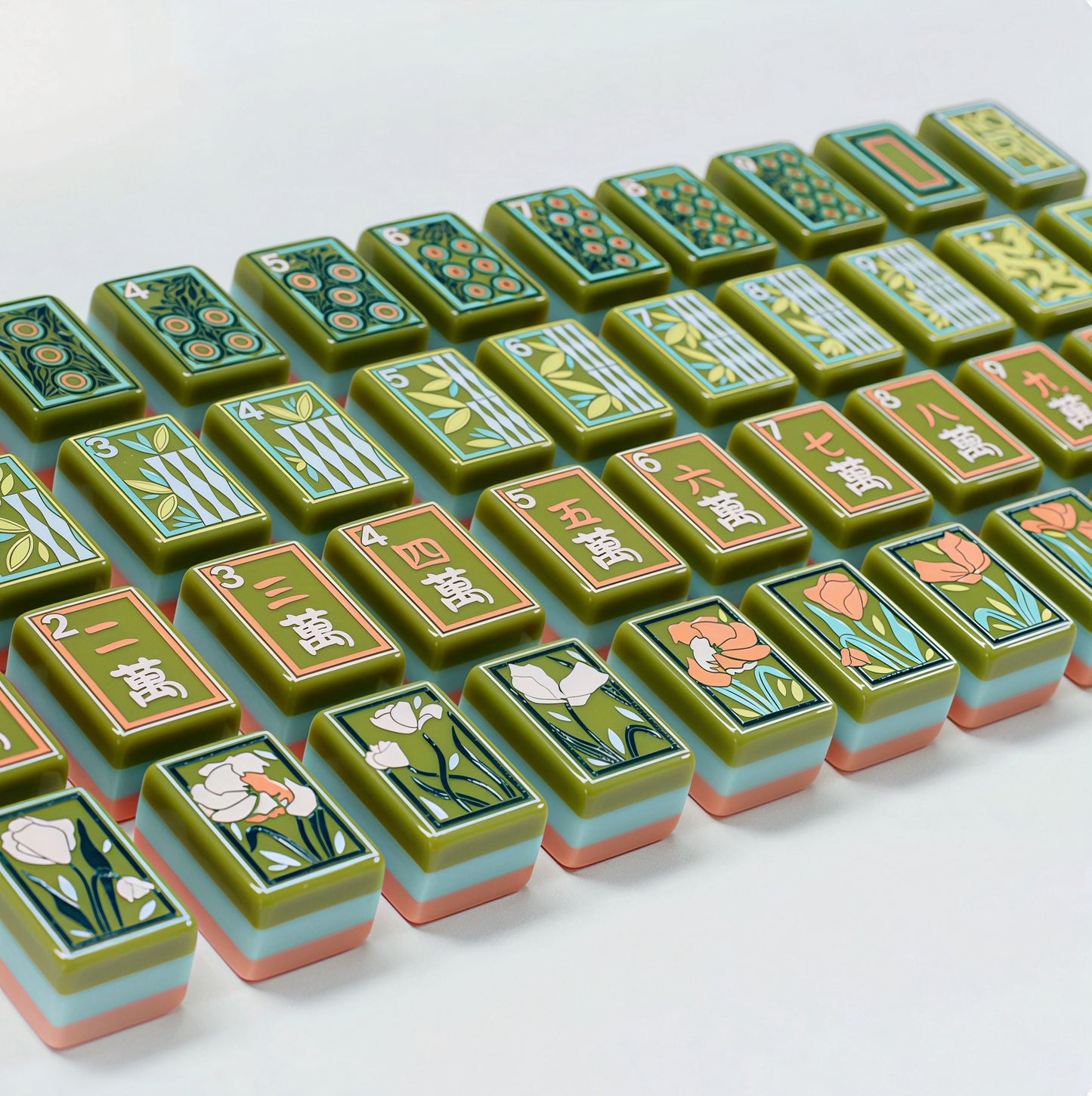 Artisan Grove artistic green and coral acrylic American mahjong tile set close-up tile artwork