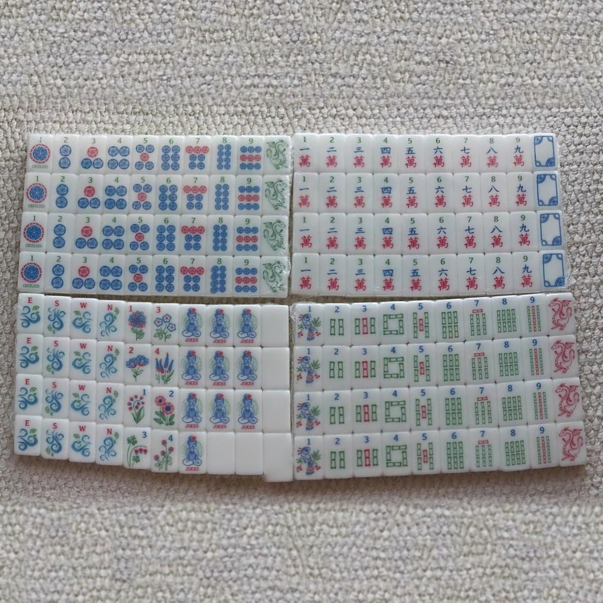 Full Florence Cream American mahjong set of 160 tiles laid out by suit