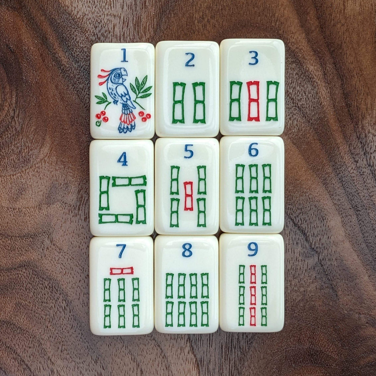 Florence Cream bam tiles one through nine with parrot one bam