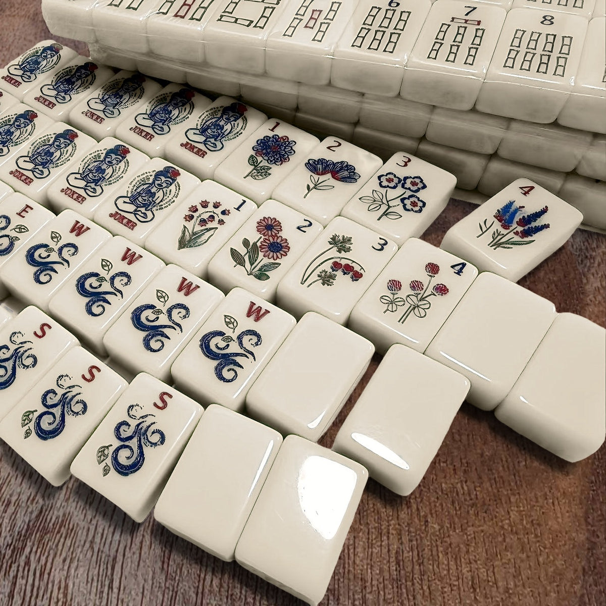 Florence Cream American mahjong tile set with jokers, flowers, winds and blank tiles on walnut