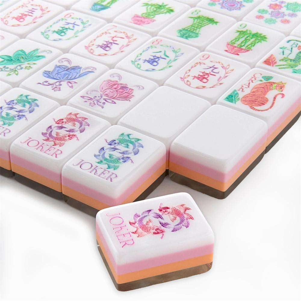 Pearl Petal pearl and blush acrylic American mahjong tile set tiles arranged on a clear pusher