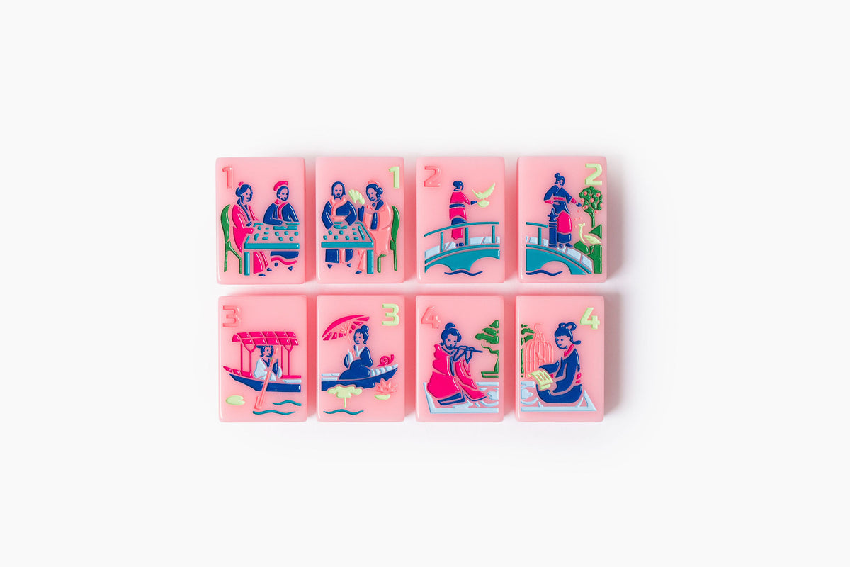 Pink Riviera pink resort-inspired acrylic American mahjong tile set tiles arranged on a clear pusher