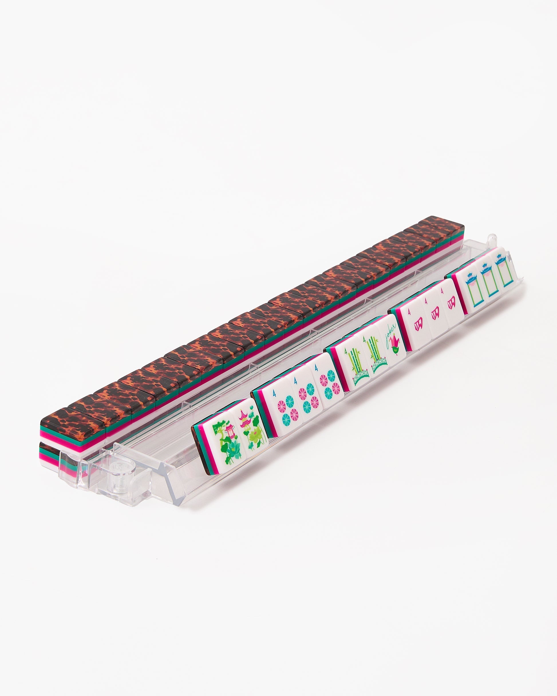 Wild Garden leopard print and fuchsia acrylic American mahjong tile set tiles arranged on a clear pusher